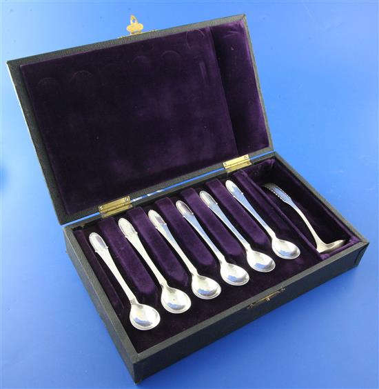 A 1920s cased set of six Georg Jensen planished sterling silver beaded pattern tea/coffee spoons and a similar cream ladle,